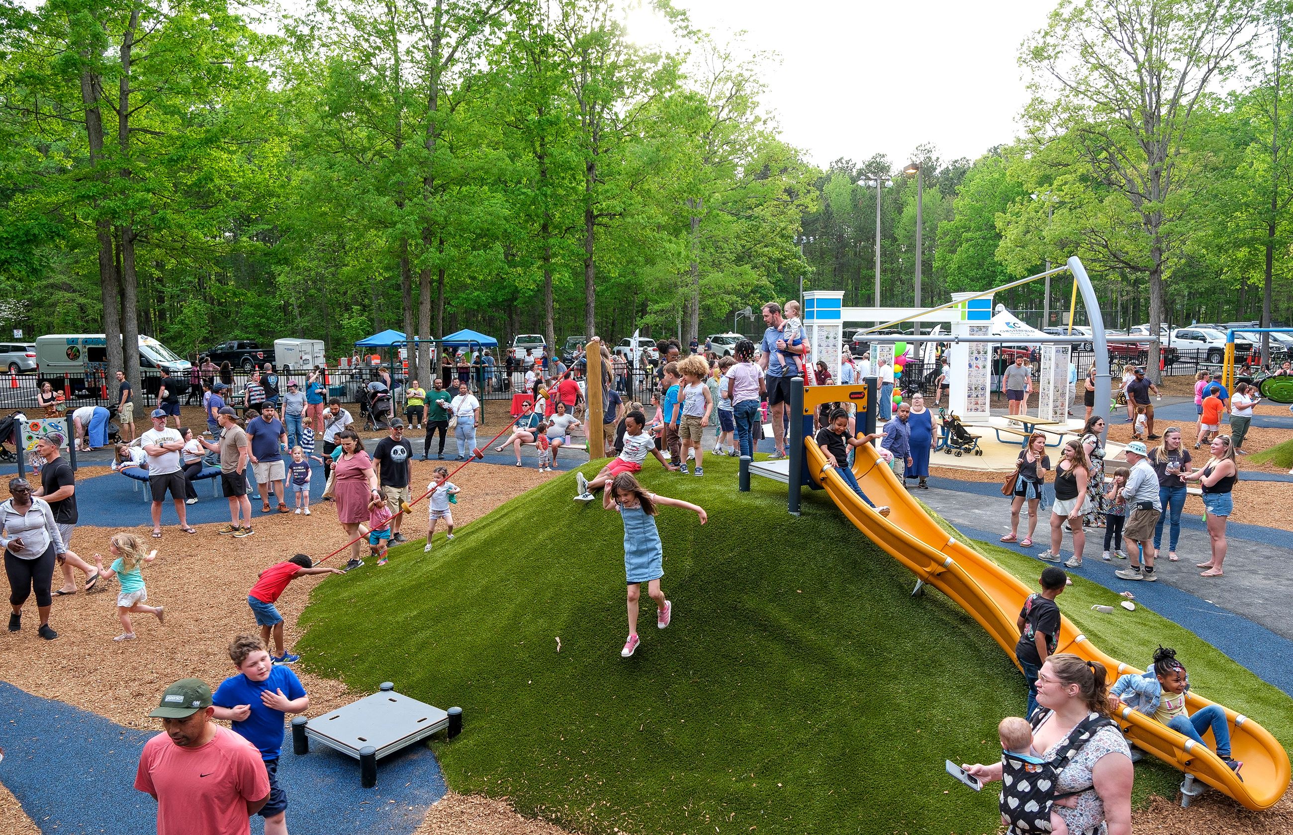 Families at the renovated Katie and Friends playground