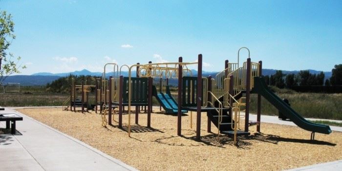 Play area at Alta Park with mountains in the background
