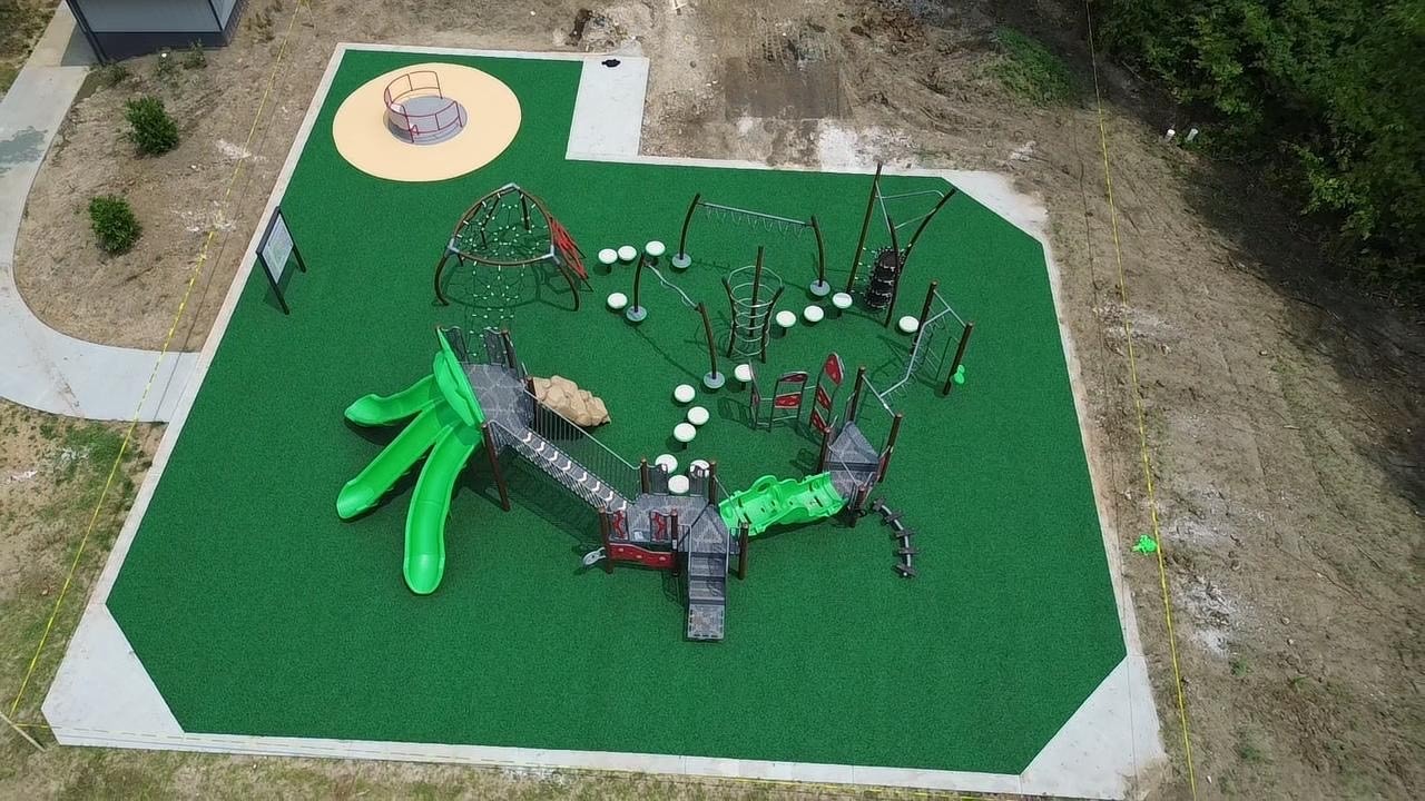 Inclusive whirl feature on pour-in-place surfacing at Binder Park