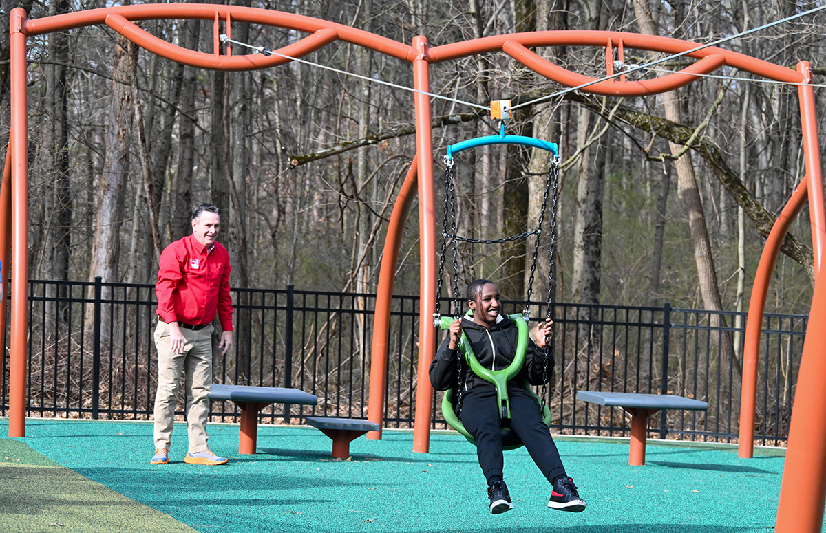 Child using the zipline at the Blendon Woods inclusive playground