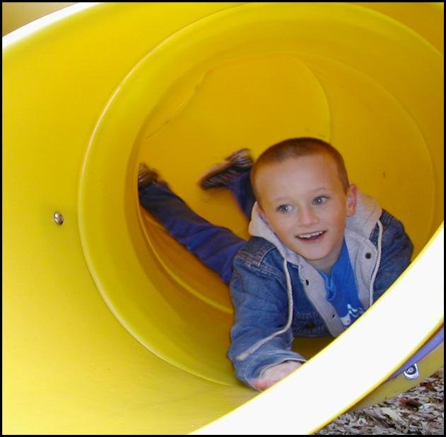 Children using inclusive playground equipment in Can-Do promotional imagery.