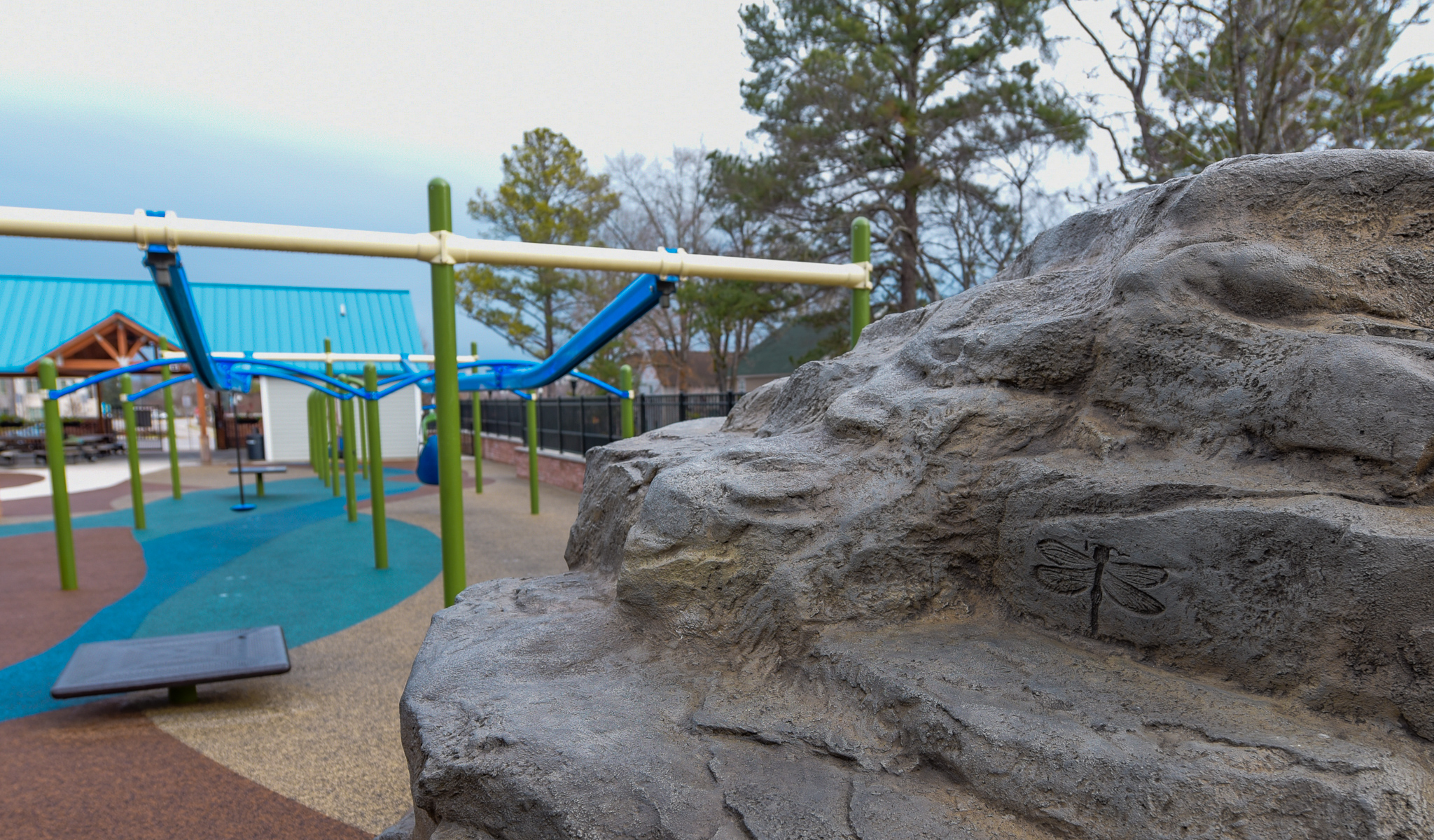 Playground seating and nearby amenities at Carraway Park
