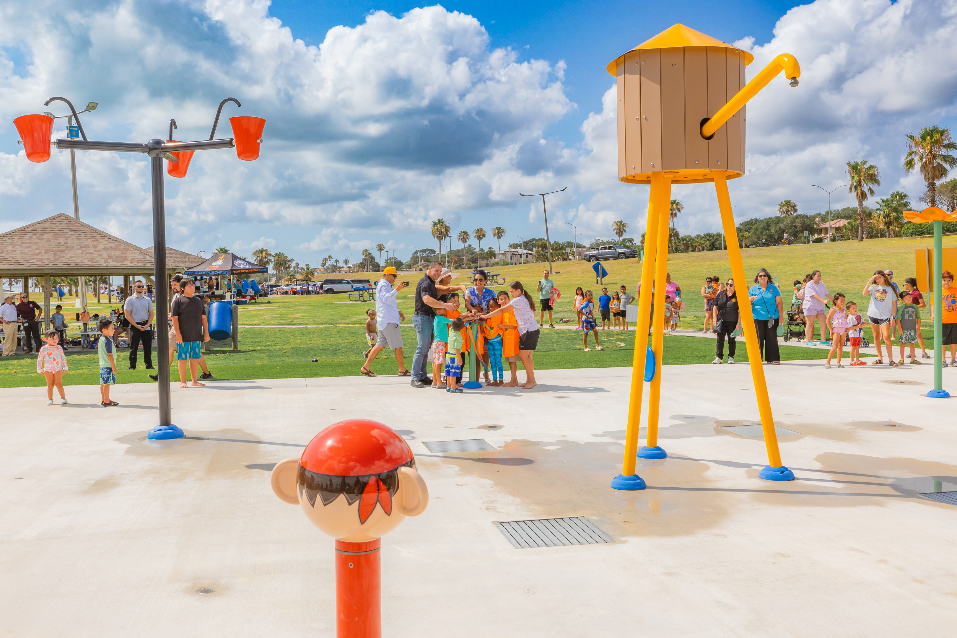 Families gathered at the Cole Park play and splash area ribbon cutting