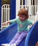 Child using a slide at Constitution Park playground