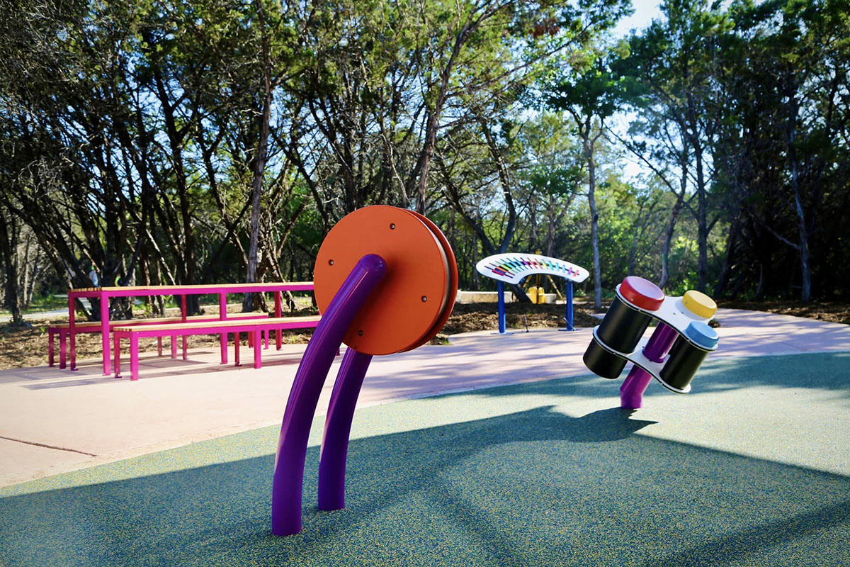 Playground equipment with bench at Dan Markson Park