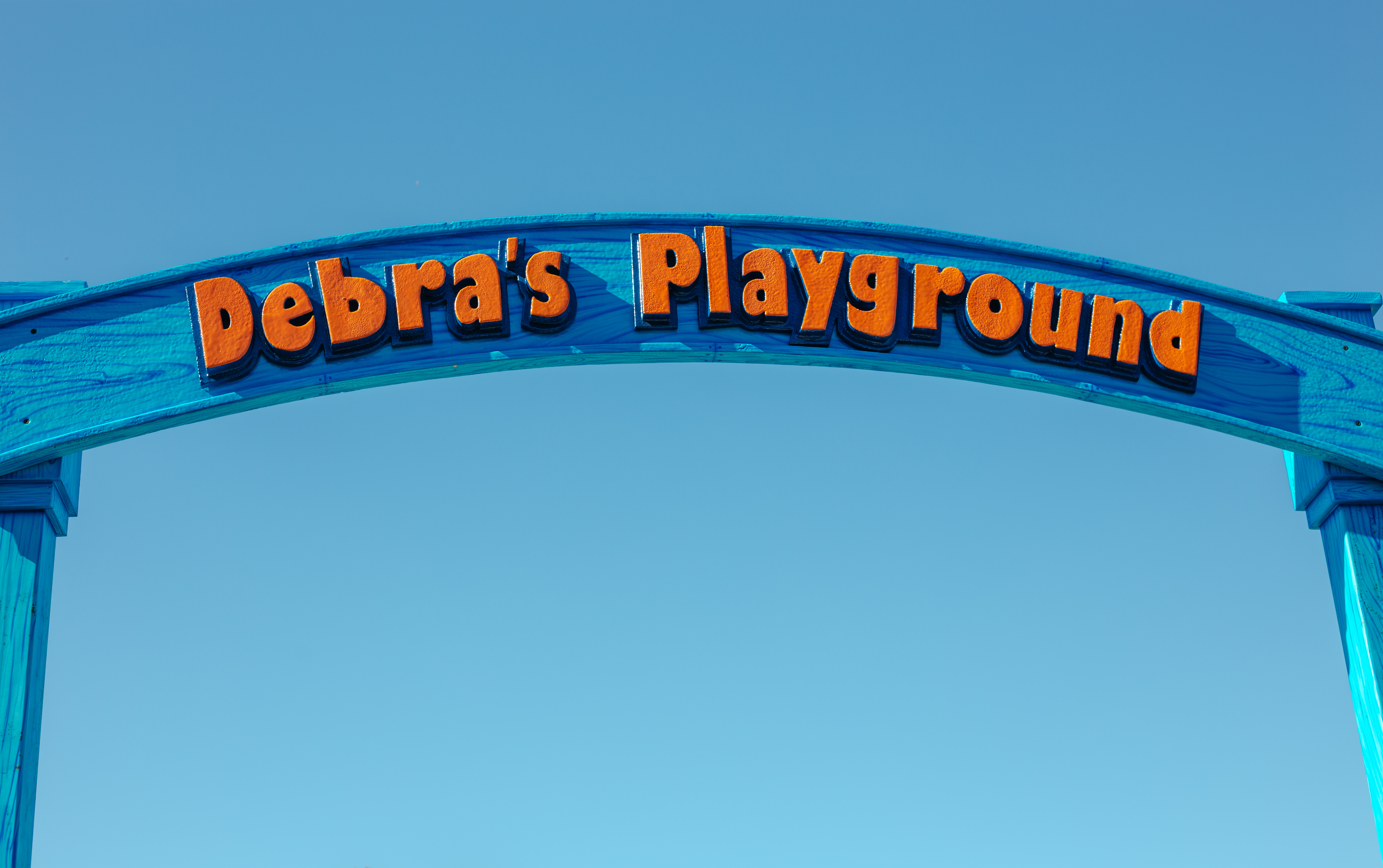Debra's Playground sign at Central Creek Park