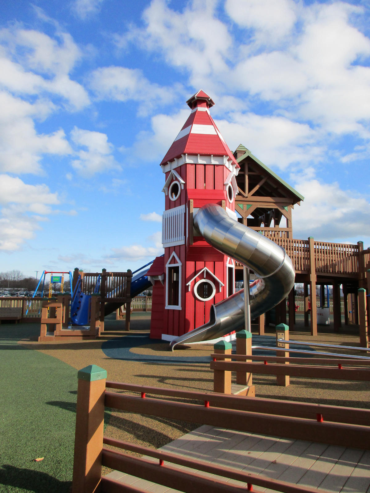 Play structure with lighthouse theming at Dream Playground