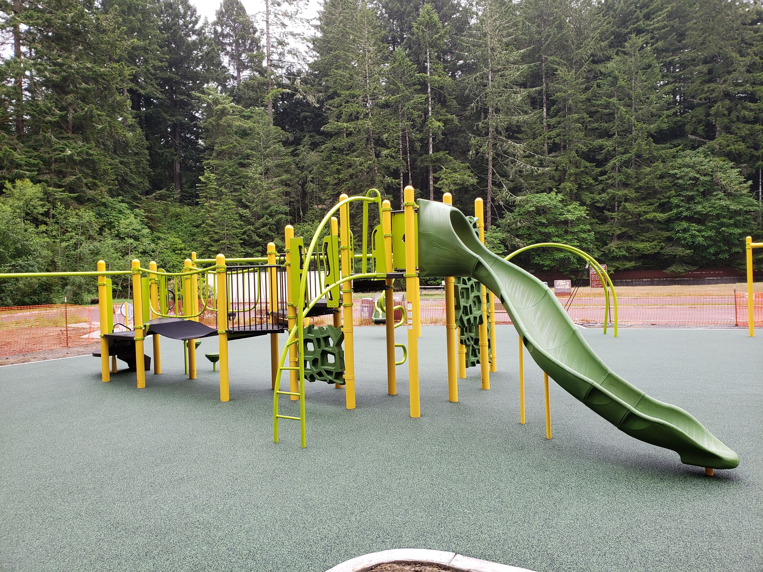 Slide and climbing feature at Freshwater Park accessible playground