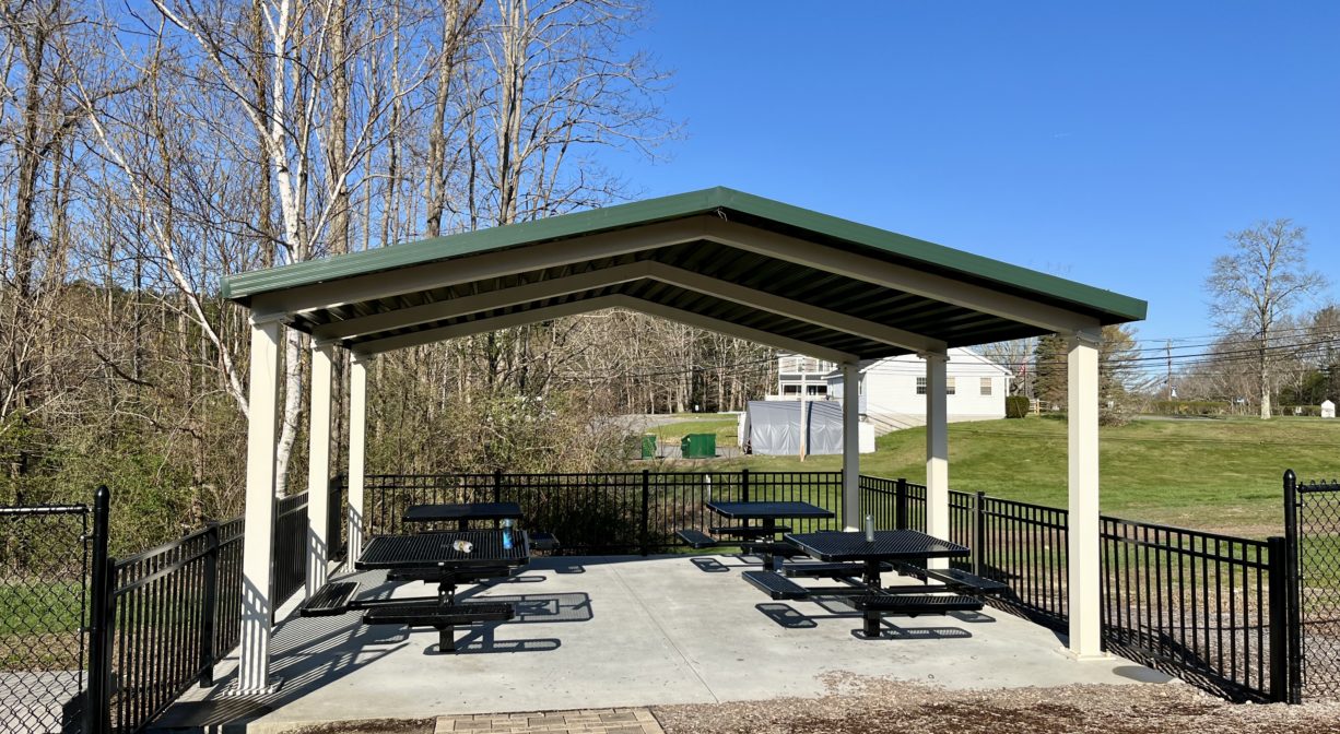 Shade pavilion with picnic tables at HOPS Playground