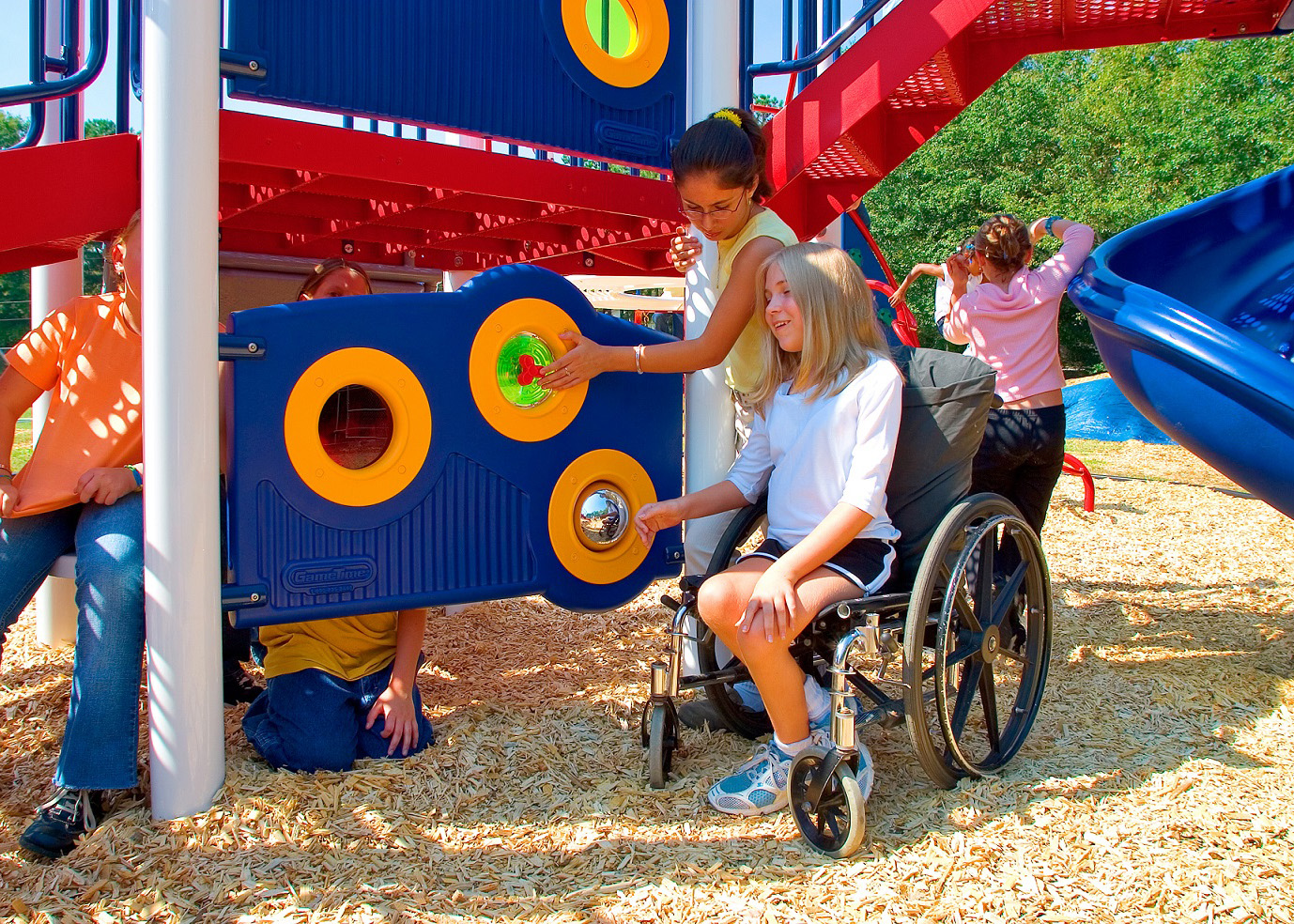 Child in a wheelchair interacting with an interpretive music panel