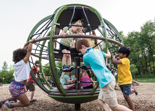 Children playing on a spinner