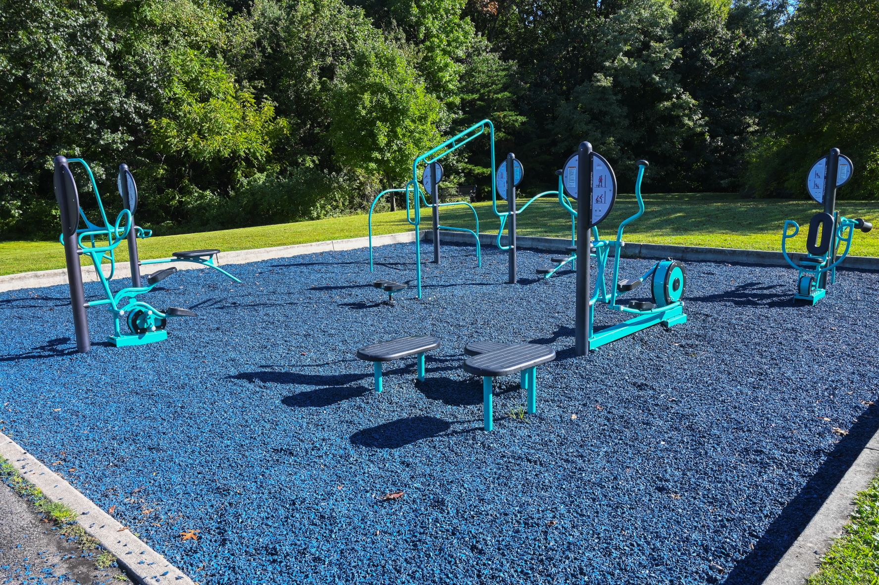 Accessible park pathway and playground features at Challenge Grove