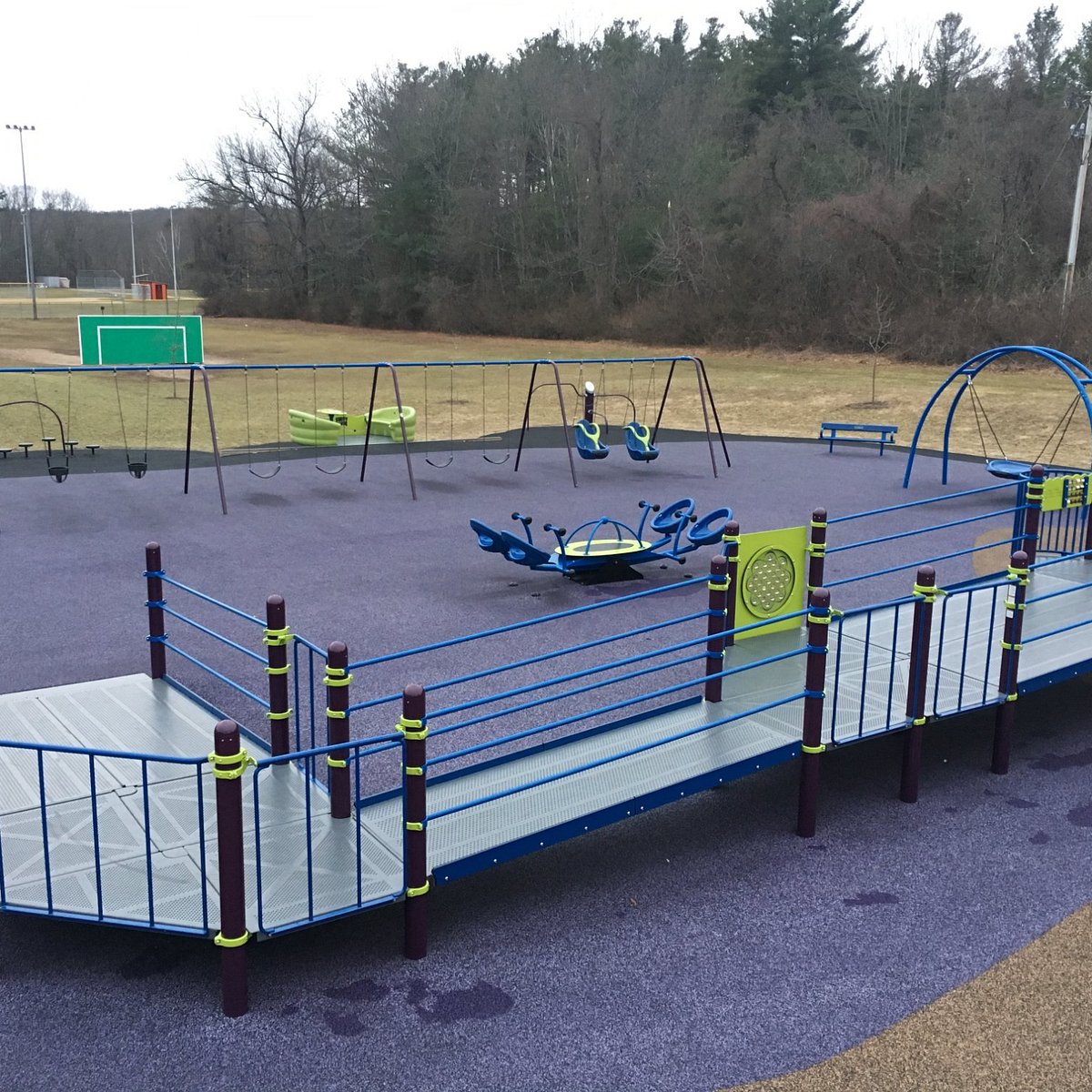 Swings and play features at Jessica's Boundless Playground