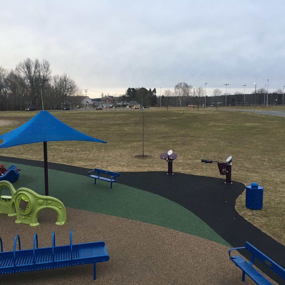 Fitness and seating area around Jessica's Boundless Playground