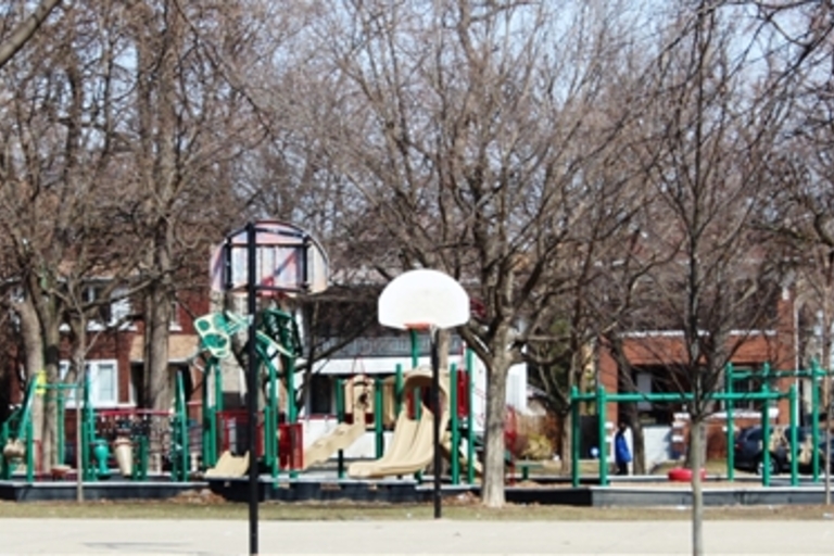 Playground and basketball hoop at John Levin Park in early spring.