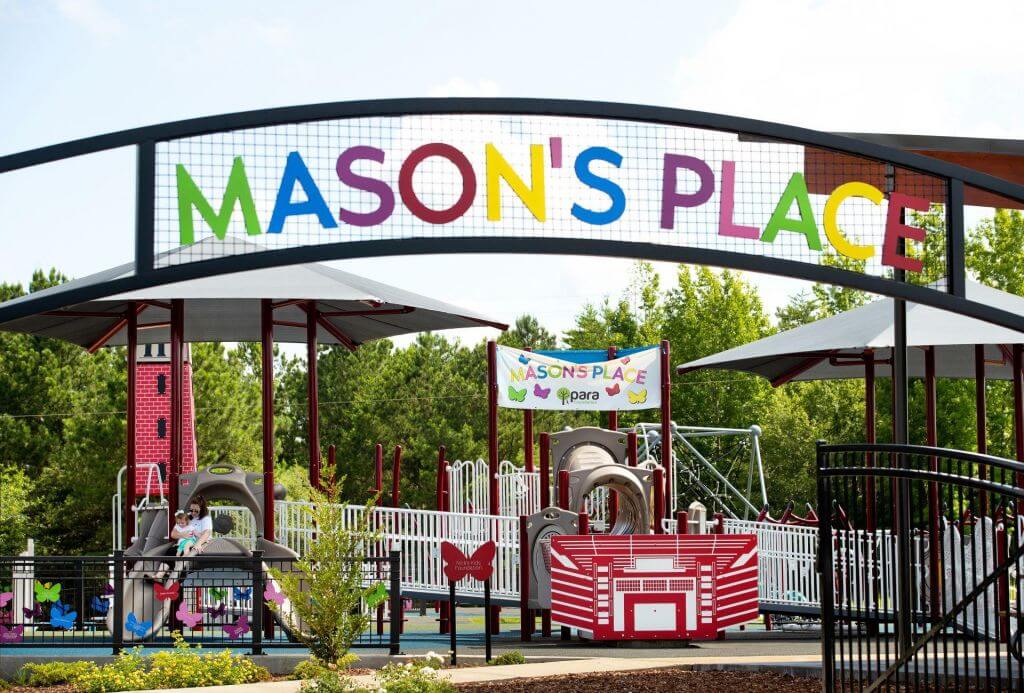 Custom Tuscaloosa-themed inclusive play structure at Mason's Place