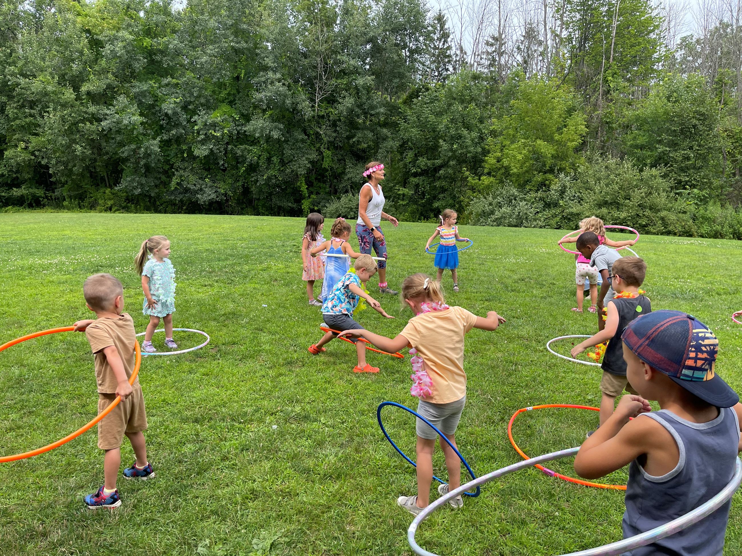 Children using outdoor camp equipment in Webster recreation programming