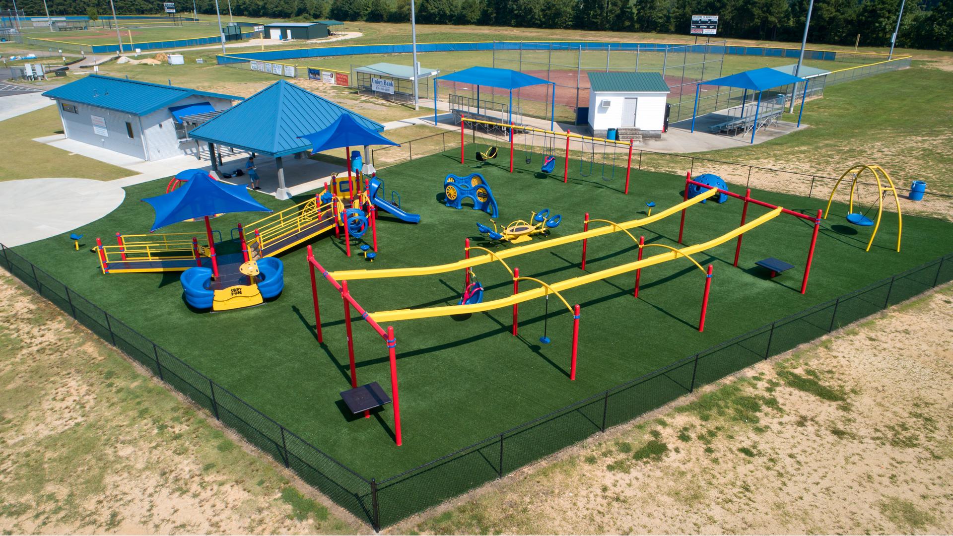 Wide view of the Miracle League of Monticello inclusive playground