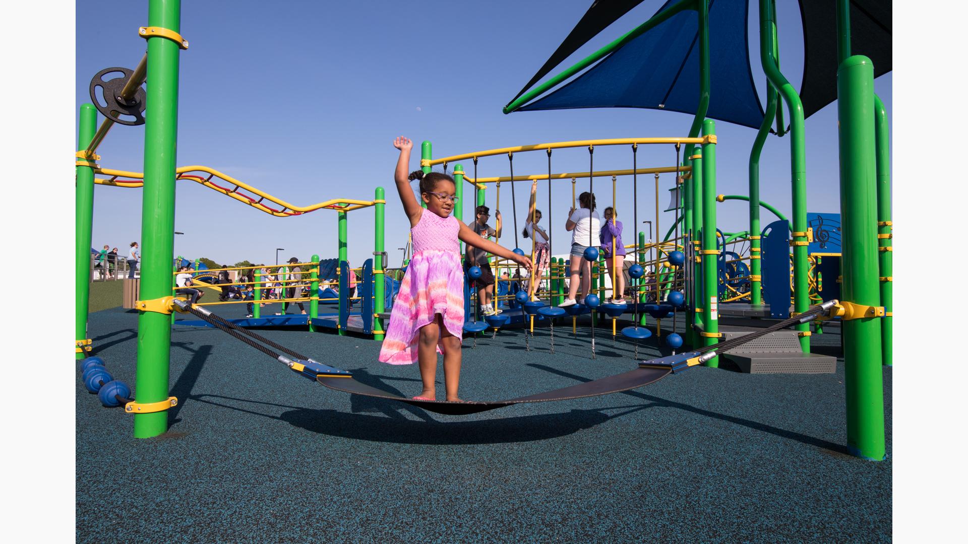 Accessible play area with marine-themed equipment at Noah's Place Playground