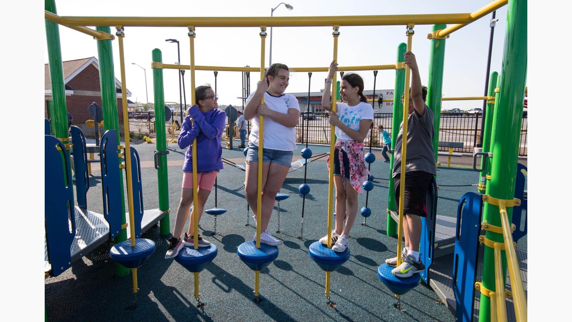 Inclusive play components and rubber surfacing at Noah's Place Playground