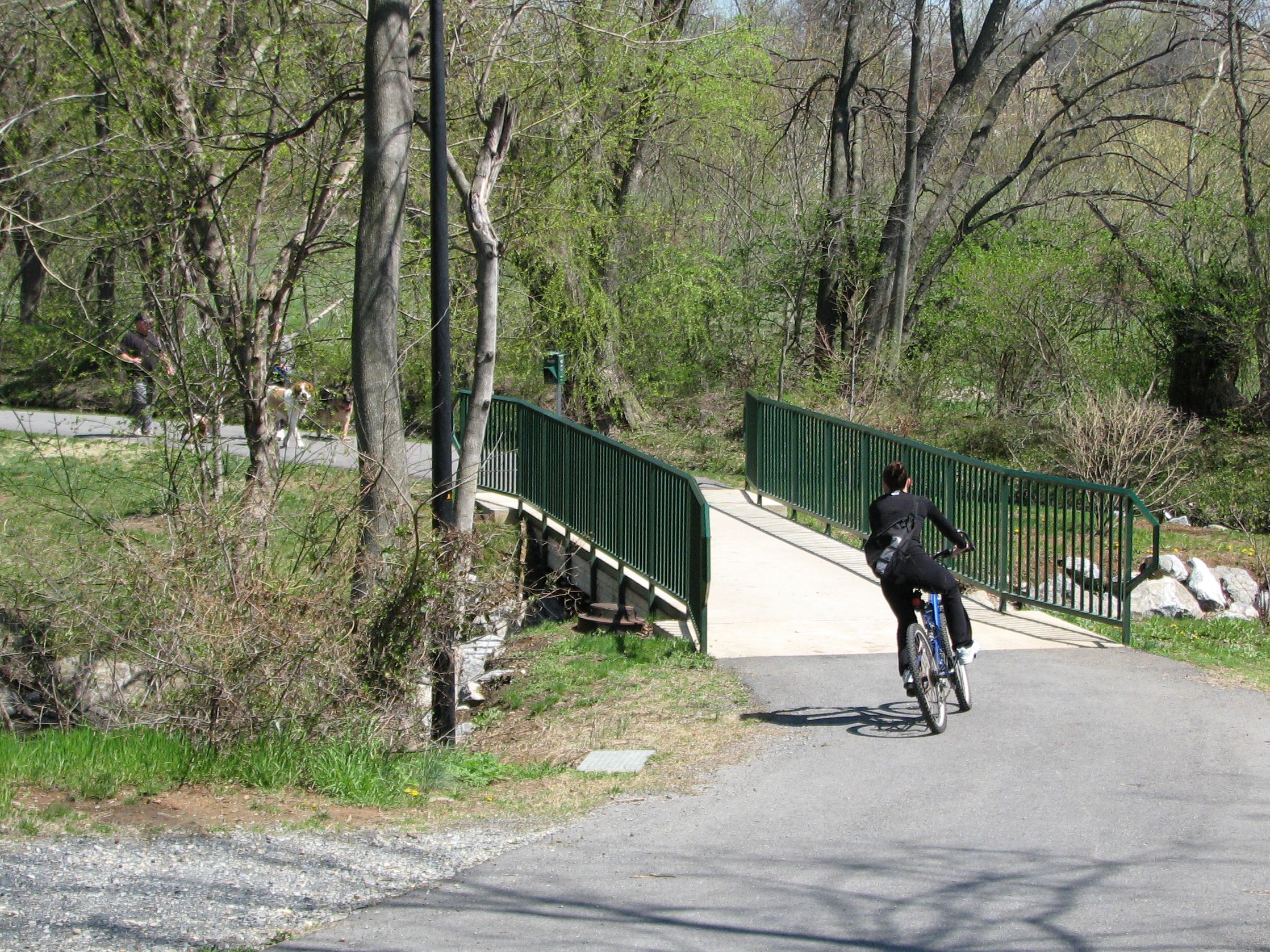 Cyclist on trail connection near Pangborn Park