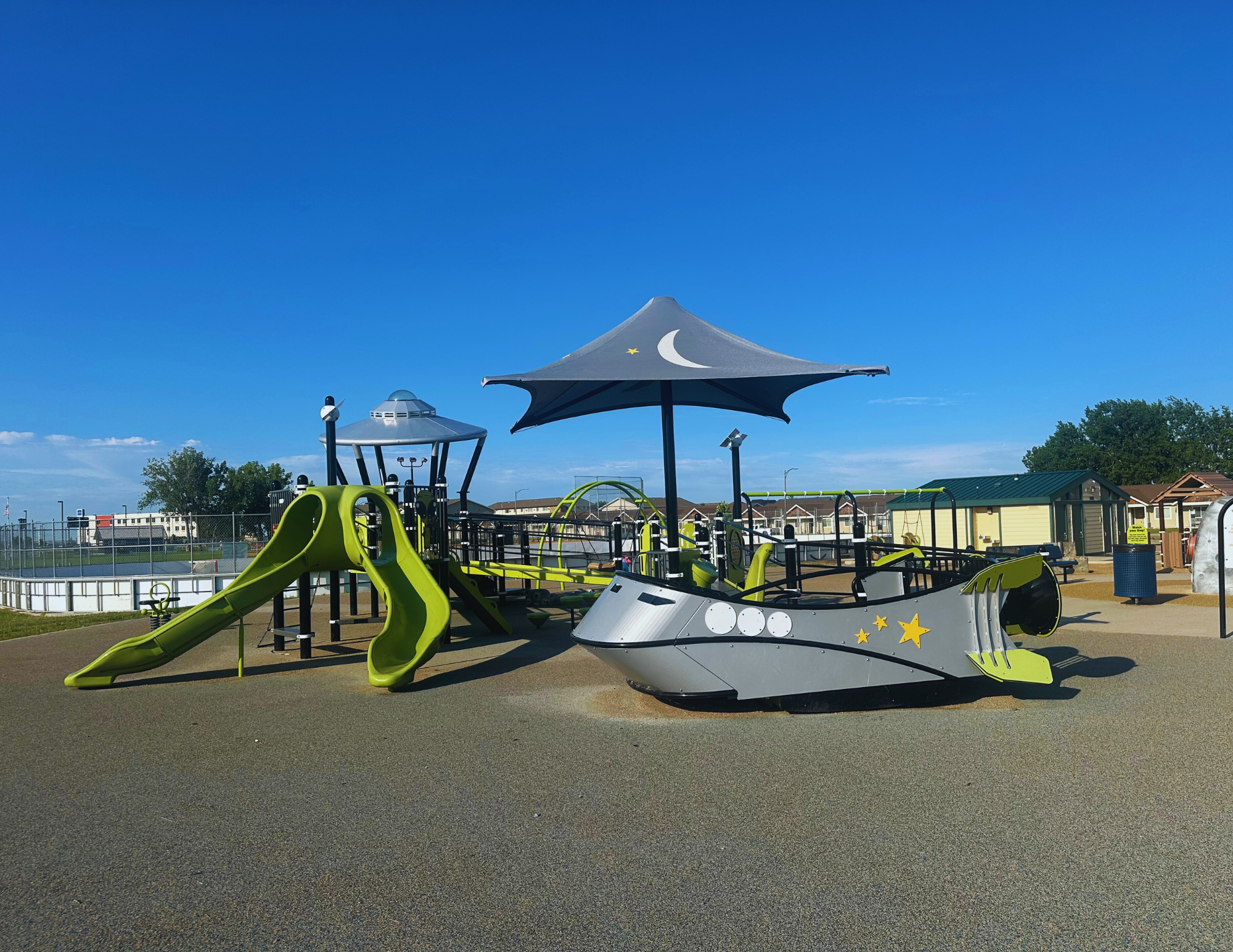 Play structure with slides and climbing elements at Play 4 All