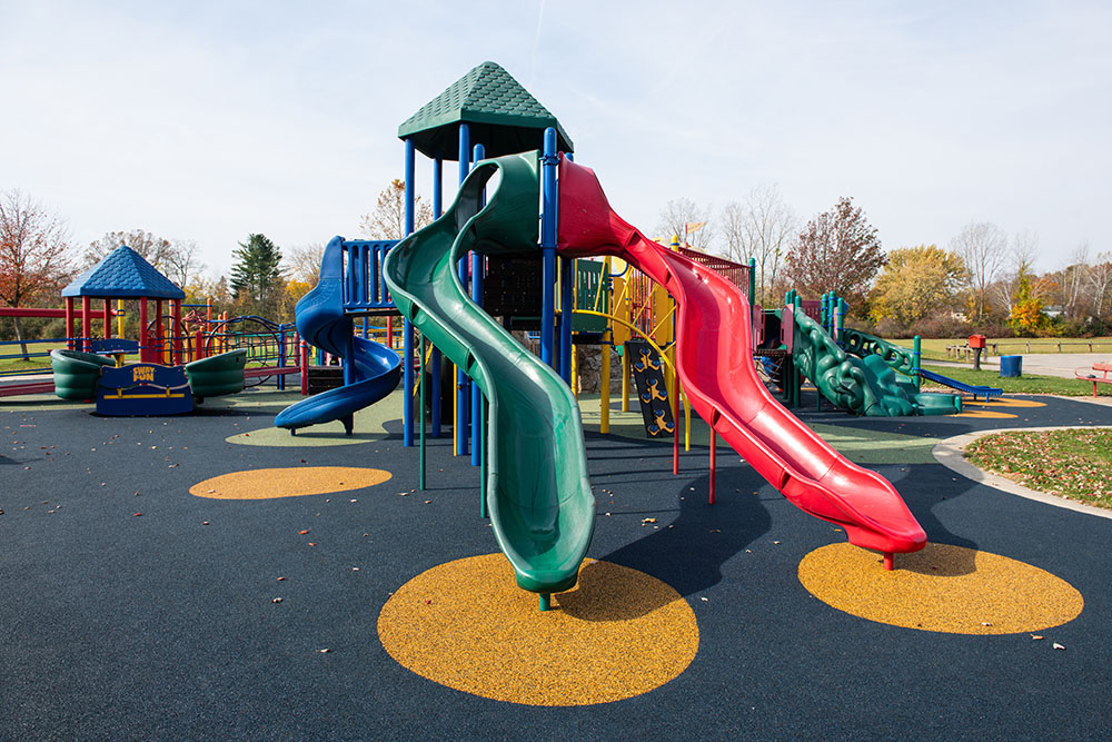 Slides and play structures at Ford Heritage Park playground