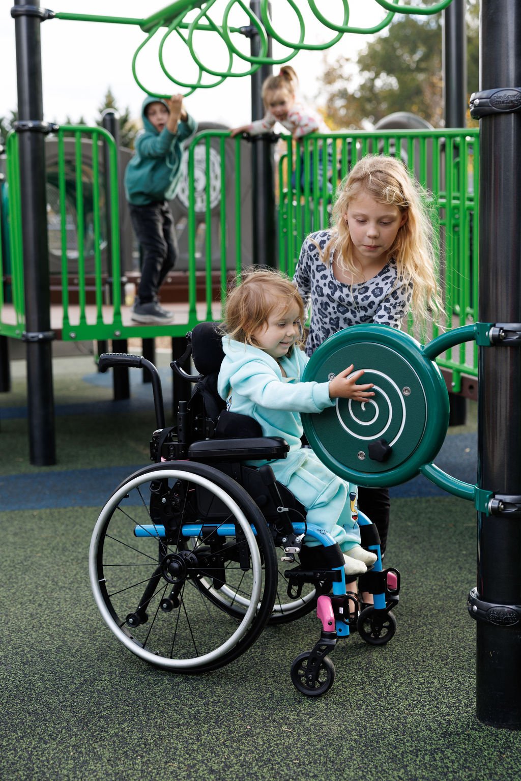 Vertical view of inclusive playground equipment at Riverview Park