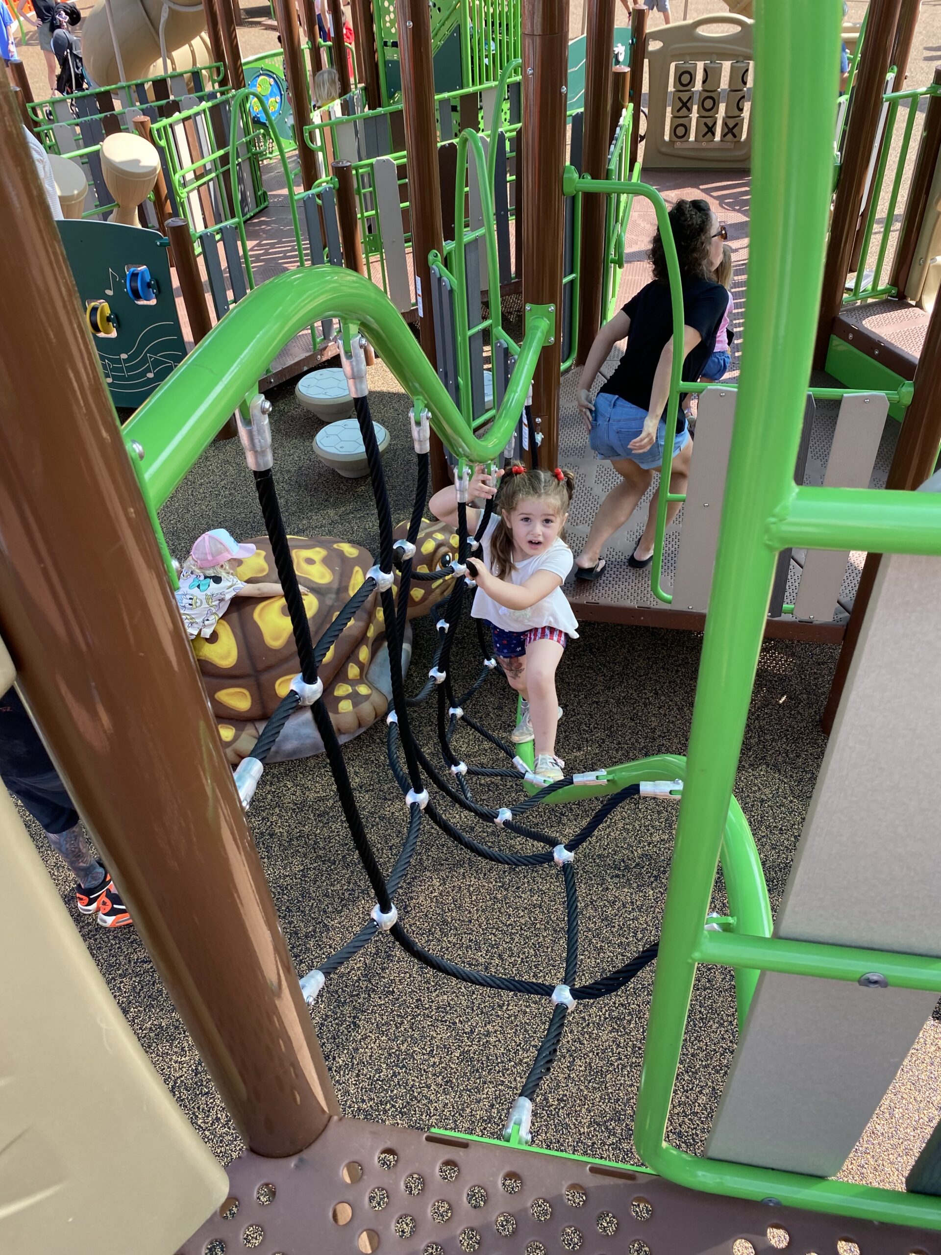 Child playing at Sara Thompson Kids Park after reopening