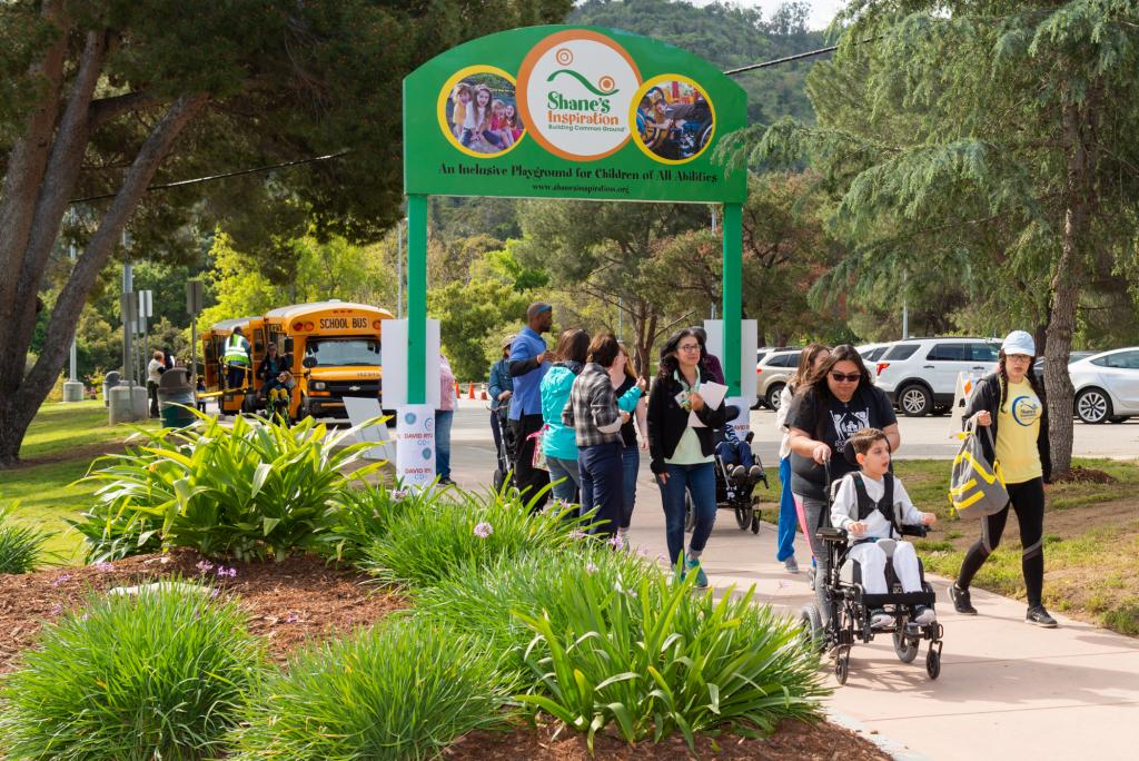 Children and caregivers at Shane's Inspiration playground