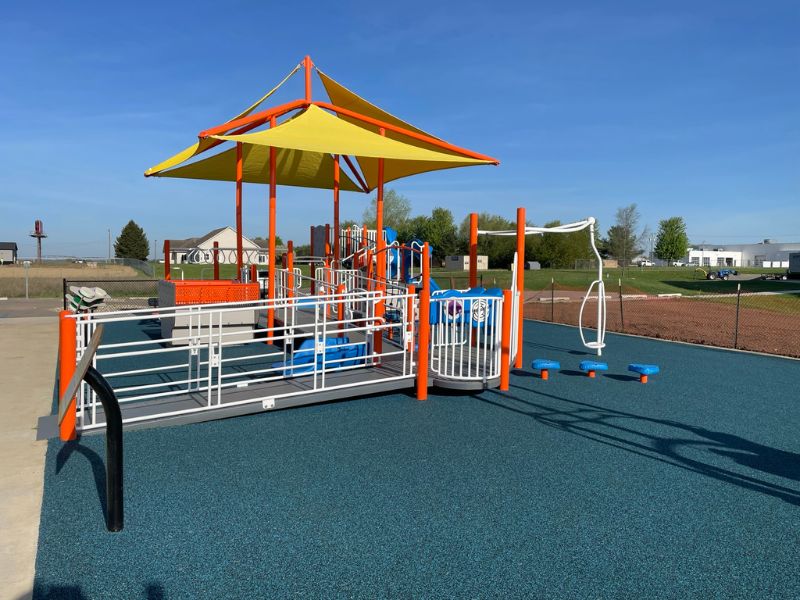 Playground layout with accessible play structure and surfacing