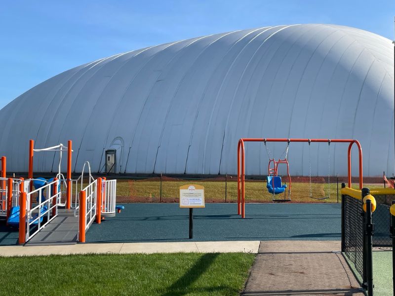 Swings at the inclusive playground in Schoolcraft