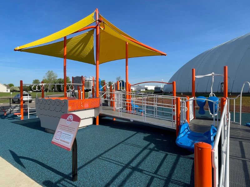 Accessible ramp and rubber surfacing at the inclusive playground
