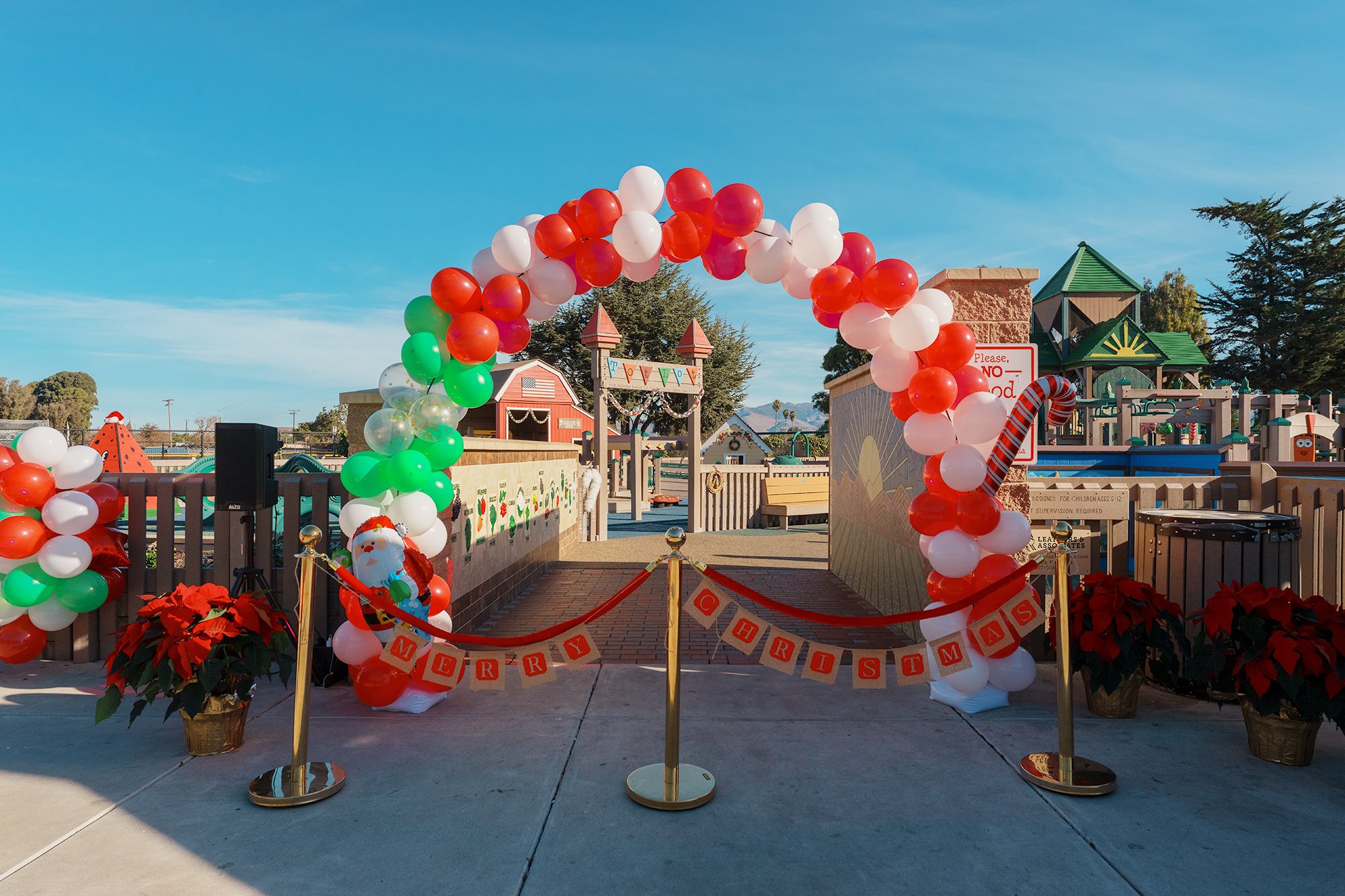 Children and families using the inclusive play space at Tatum's Garden