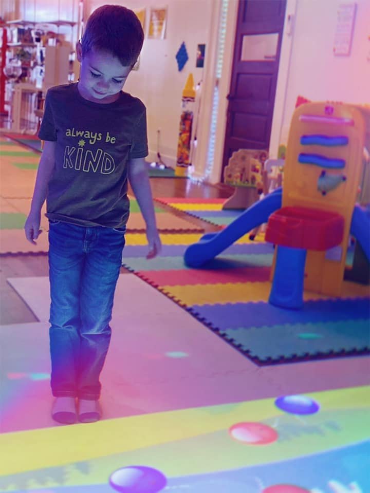 Children using indoor play features at The Social Club