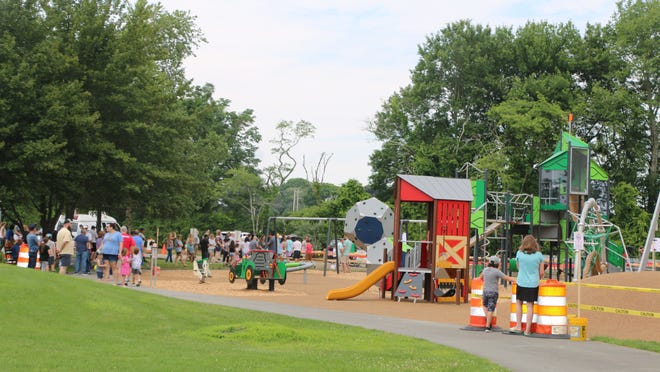 Children using the new Town Farm Playground in Tiverton