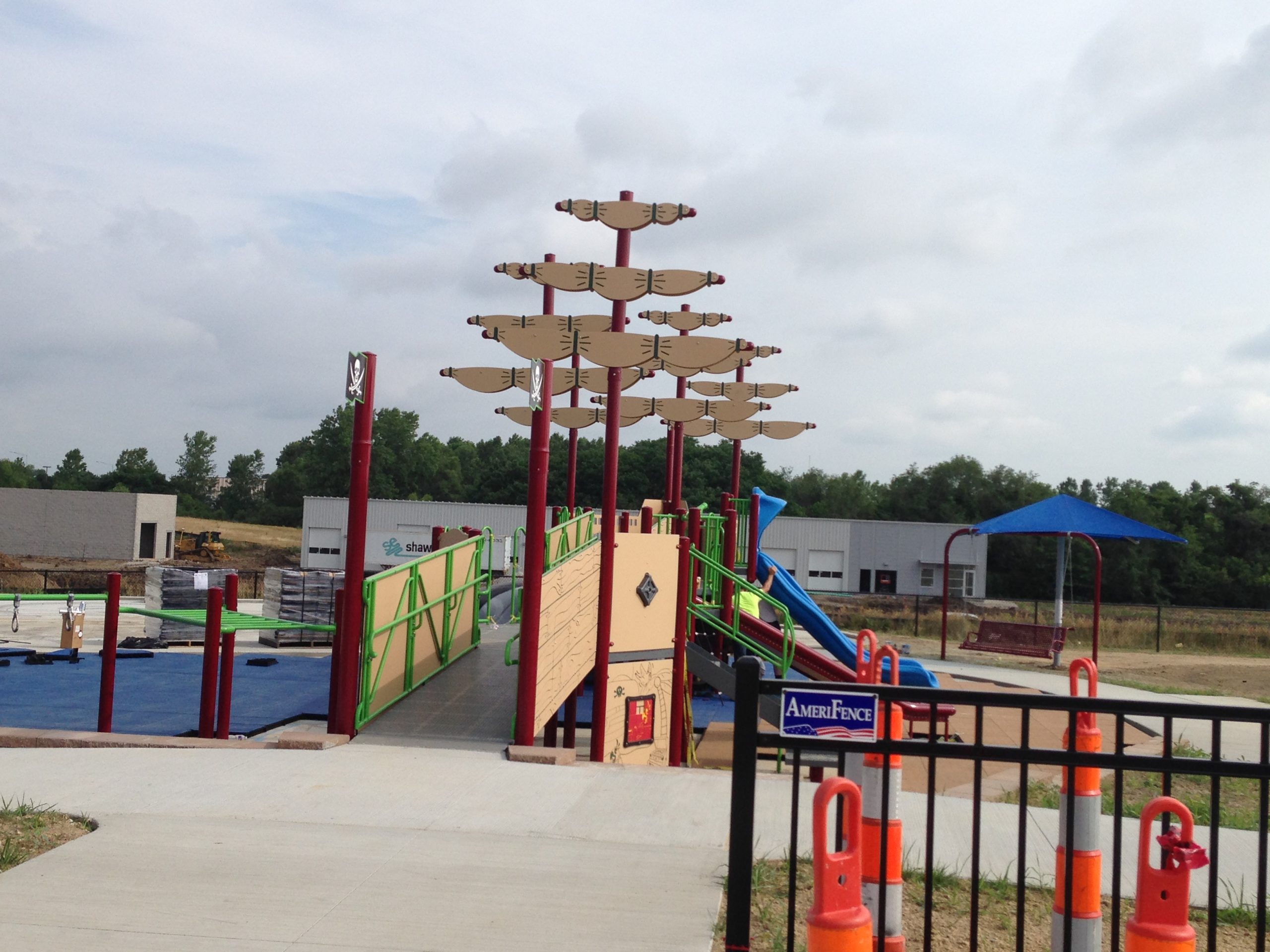 Families using the Variety KC playground at Tiffany Hills Park