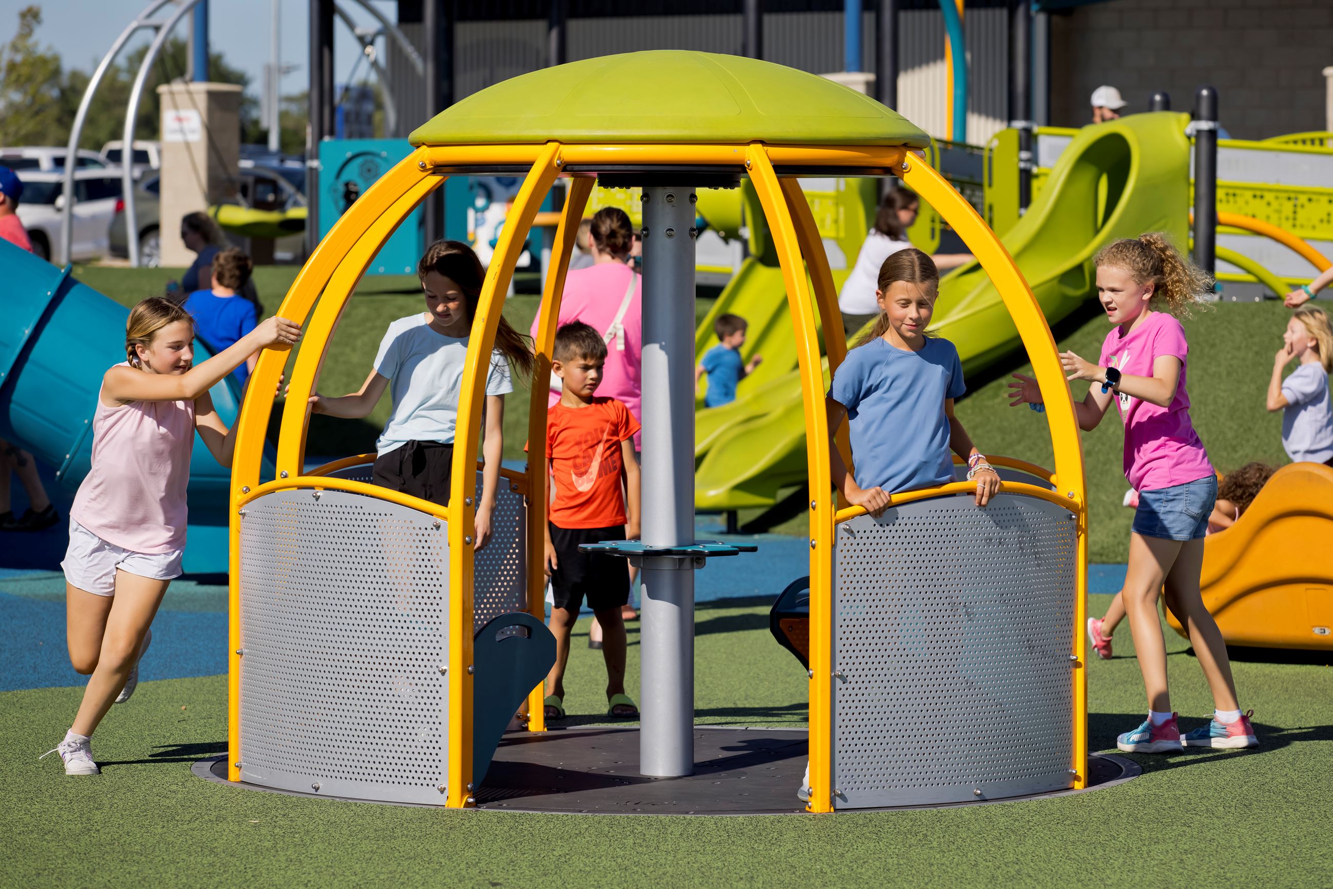 Roll-in zero-entry merry-go-round at Triumph Park