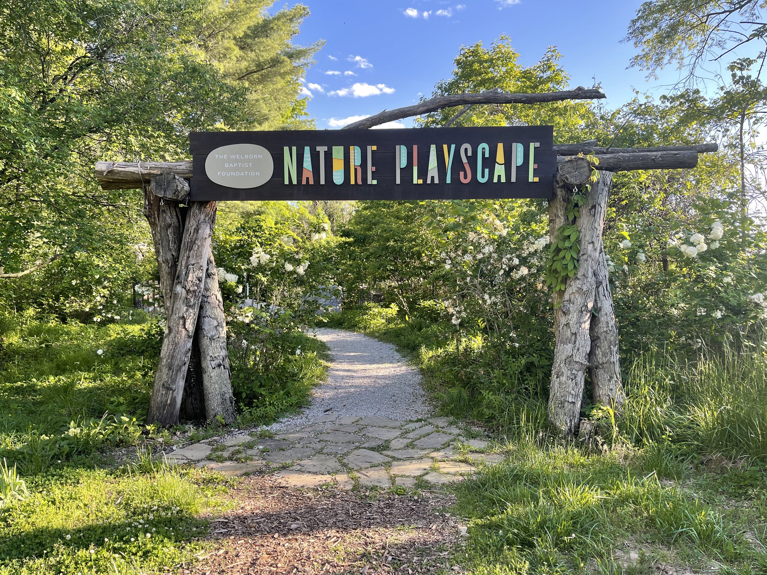 Entrance to the fenced nature playscape at Wesselman Woods