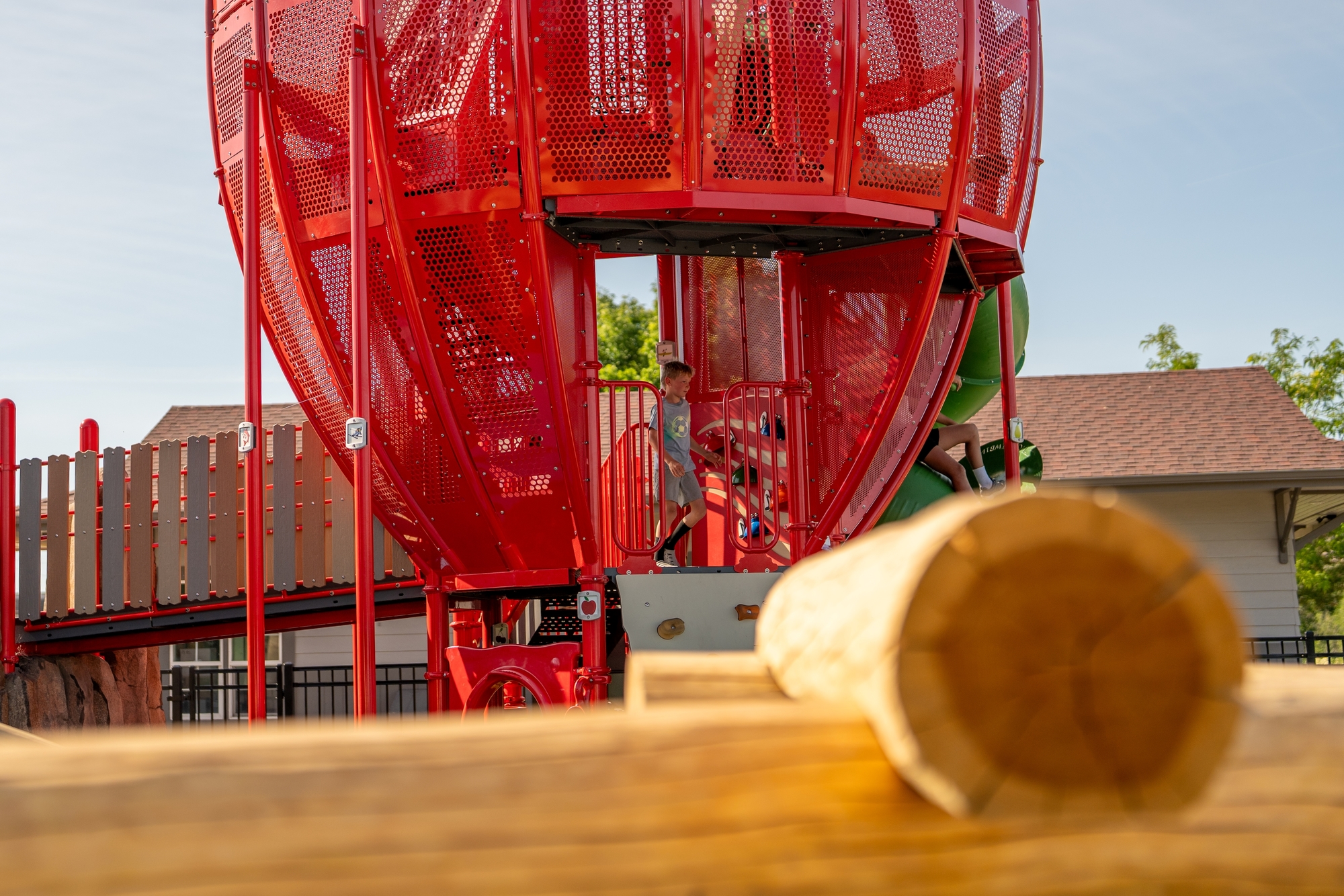 Ground-level play features and cushioned surfacing at the Apple Playground