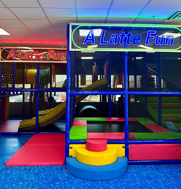 Large indoor climbing structure and slide area at A Latte Fun.