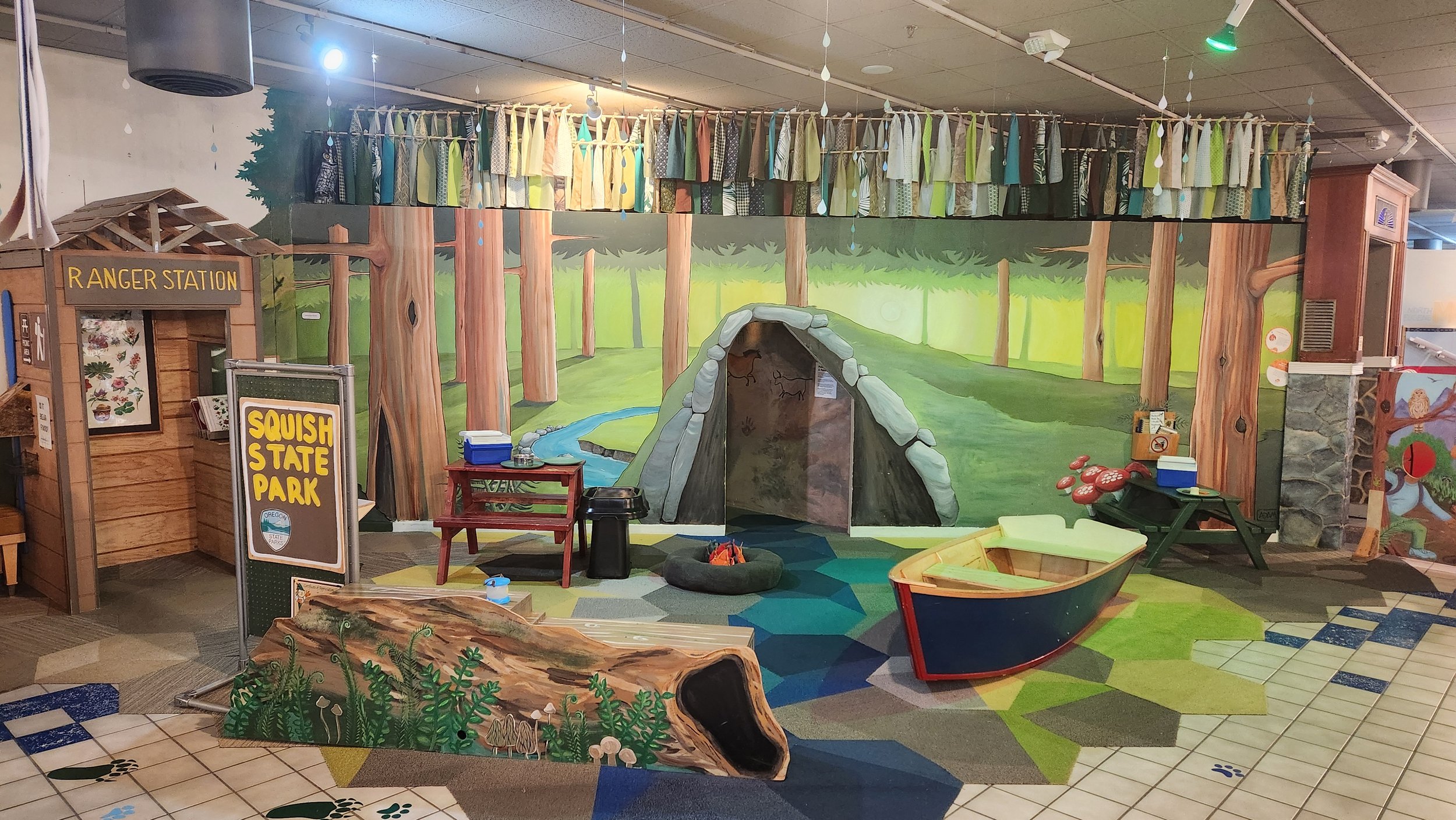 Woodland-themed exhibit area at Adventure! Children's Museum in Eugene.