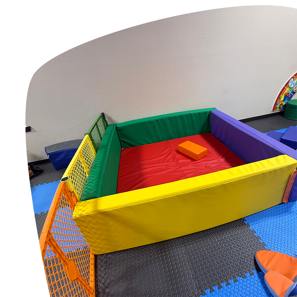 Padded baby-and-toddler play area at Adventure Zone Mineola.