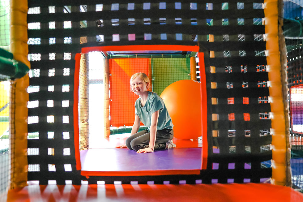 Child inside the Adventureland play structure in Perham