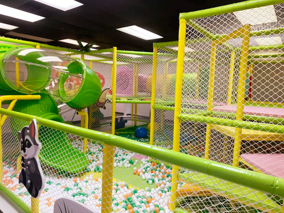 Multi-level soft-play tunnel and ball pit at Adventurz Creative.