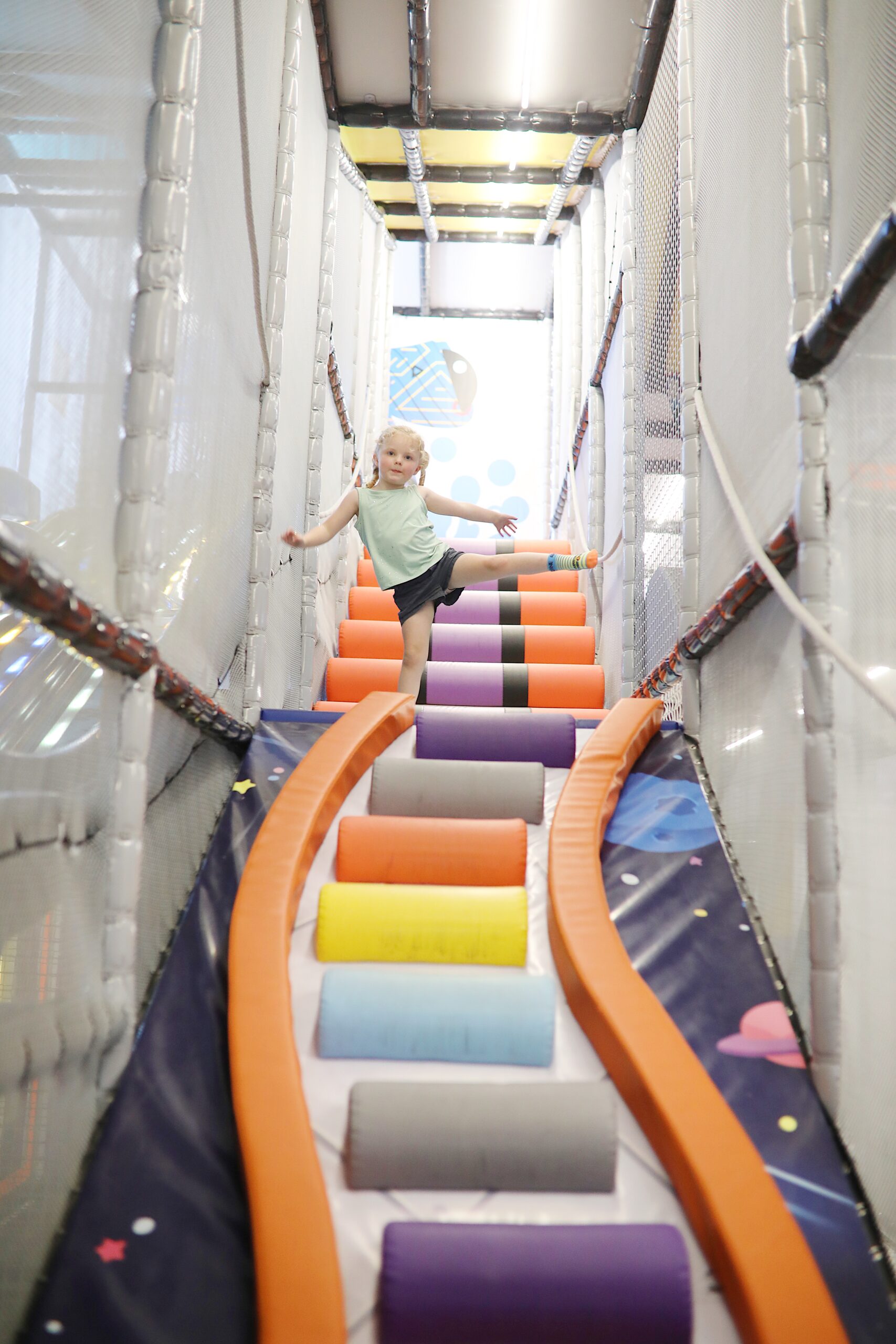 Children playing inside the SpaceStation playground at Airborne Lindon