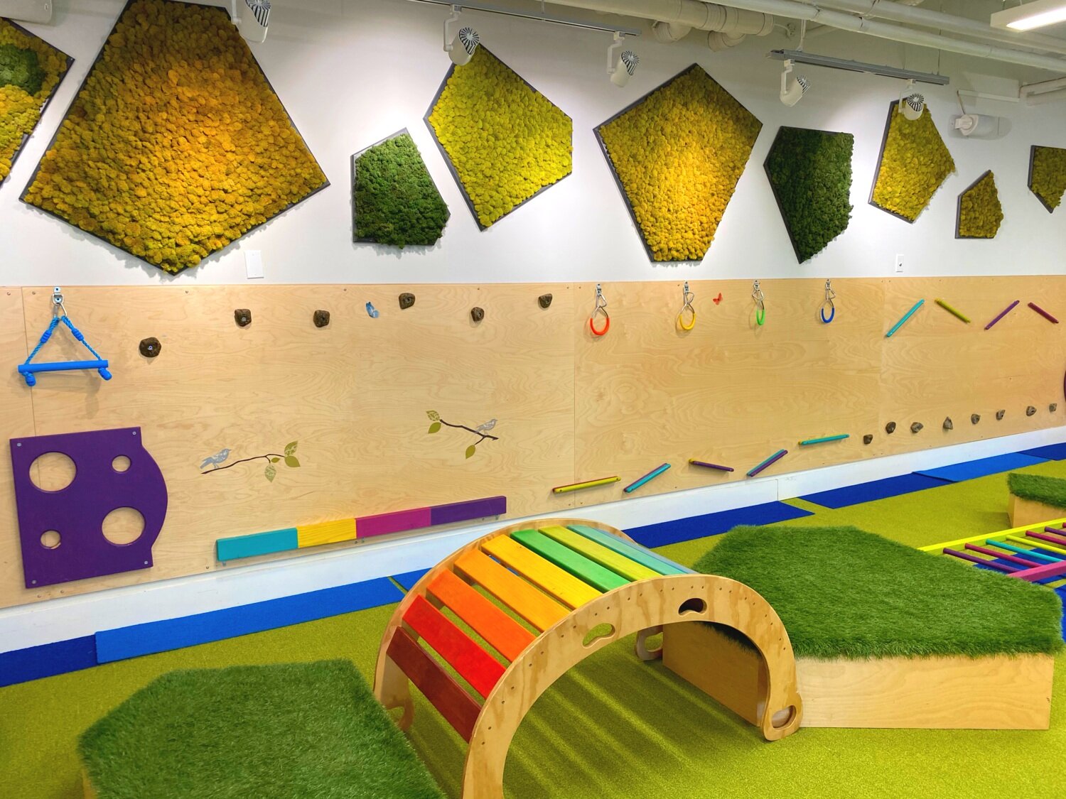 Wooden bridge and soft movement area at Allo Boston.