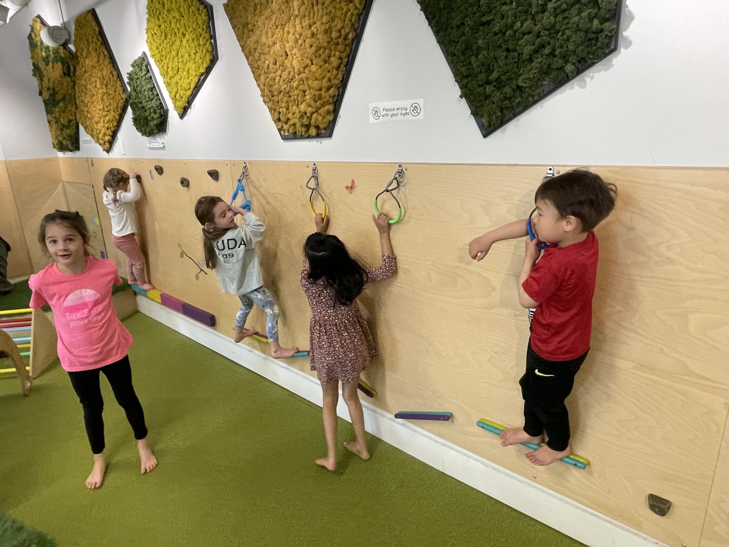 Indoor climbing and play area designed for young children at Allo Boston.