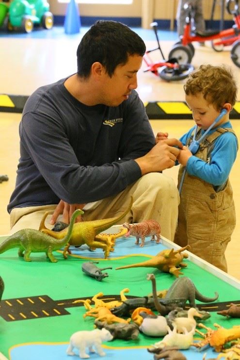 Caregiver and toddler playing together at Arcata Play Center in Arcata