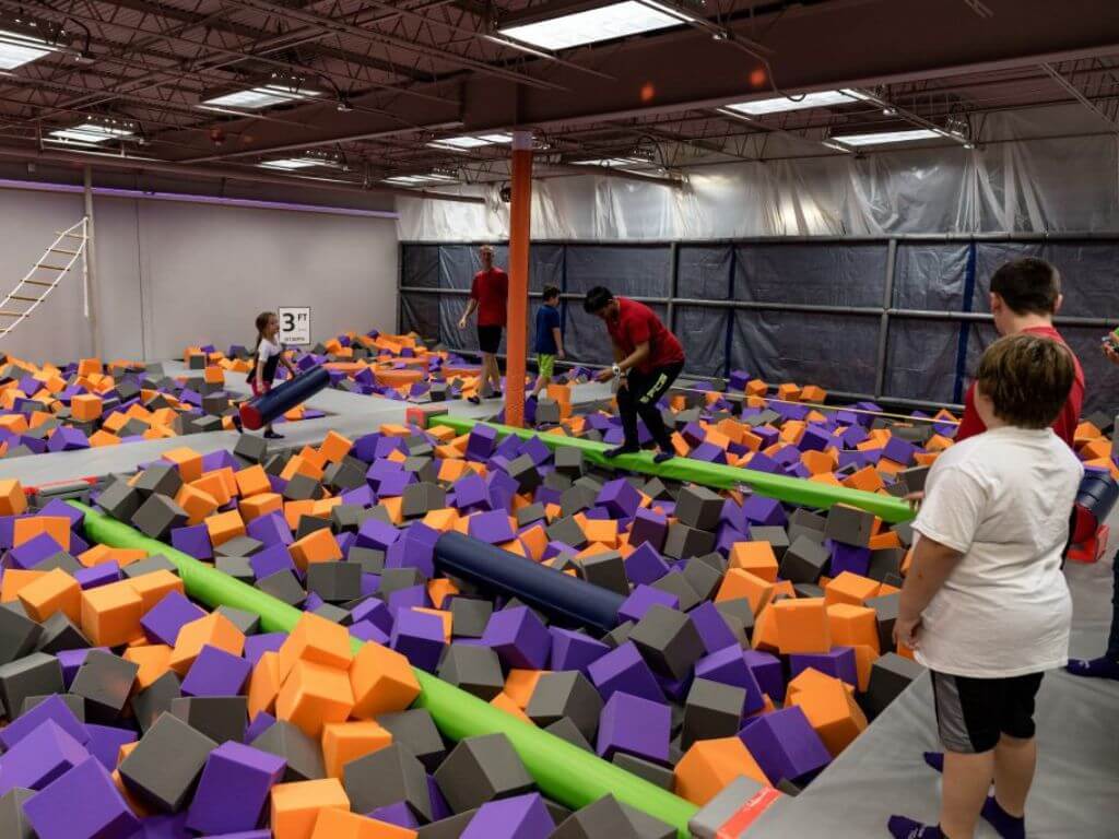 Foam-pit style active play area during a sensory-themed event at Axtion Air